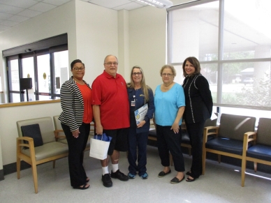 From left are: Vice President of Clinics Kanna Page, Robert Sarafinis, Clinic LPN Anna Sellers, Corrine Sarafinis and President/CEO Michele Sutton. Not pictured is Dr. Hugo Valdes.